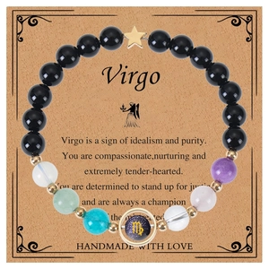 Detail of Virgo constellation bracelet with natural gemstones and zodiac card