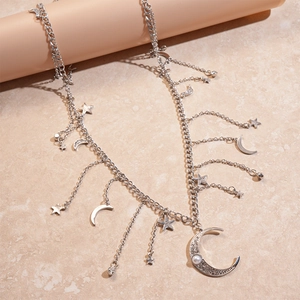 Detail of silver star moon chain belt with rhinestone moon and hanging faux pearl pendants