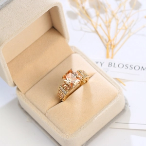 Macro detail of gold-plated punk ring with square champagne zircon and micro-pave setting