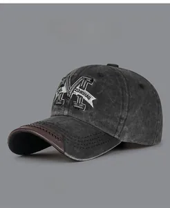 Close-up of vintage washed cotton baseball cap featuring 3D letter M embroidery