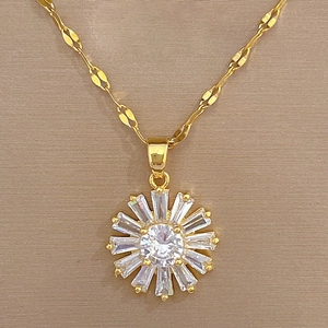 Detail of sunflower necklace pendant with gold plating and sparkling baguette-cut zircons
