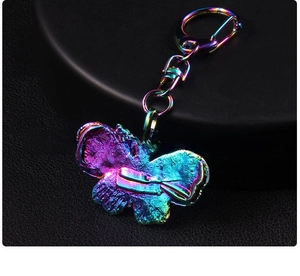 Detail of butterfly keychain back with rainbow iridescent plating and lobster clasp