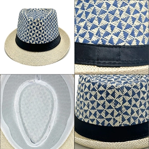 Detail view of the breathable mesh lining and checkered straw weave on this trilby hat