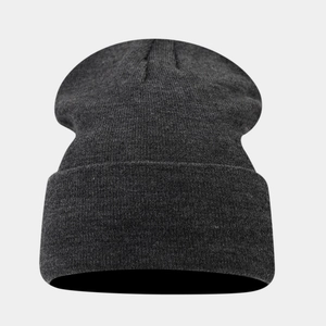 Detailed knit texture of a dark grey stretch beanie with wide fold-up cuff design