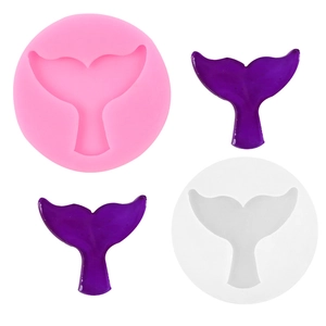 Macro detail of pink and clear silicone molds for crafting mermaid tails and shells