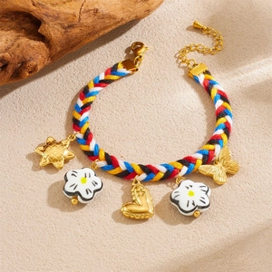 Handmade colorful woven rope bracelet with gold-plated charms and floral details