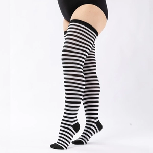 Detail of plus size black and white striped over-knee socks with high elastic cuffs