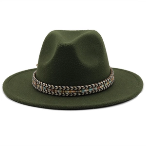 Detailed view of dark green wool fedora with a colorful geometric woven decorative band