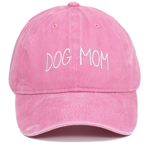 Close-up of white DOG MOM embroidery on pink washed cotton vintage baseball cap