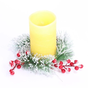 Christmas LED pillar candle with snowy cedar needles and red berry wreath decoration