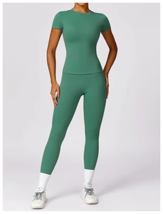Close-up of teal quick-dry yoga t-shirt with detailed high-elasticity fabric stitching