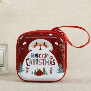 Detail of red Christmas coin purse featuring Santa Claus print and a zipper closure