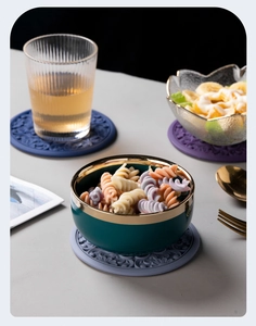 Detailed close-up of heat-resistant silicone coasters with classic embossed patterns