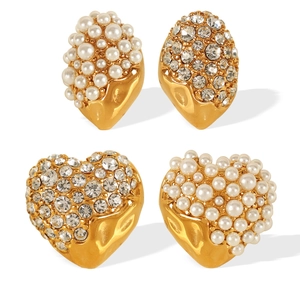 Golden earrings set with pearls and rhinestones in heart and water drop shapes