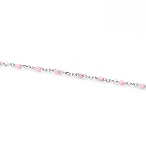 Macro detail of silver stainless steel chain with pink enamel dots for DIY jewelry