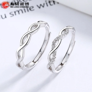 Macro view of adjustable 925 sterling silver couple rings with pavé set cubic zirconia