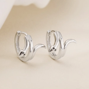 Minimalist silver snake-shaped hoop earrings with black gemstone eyes for women