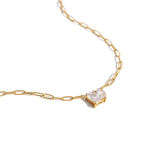 Elegant gold titanium steel necklace featuring a heart-shaped zircon pendant and unique link chain