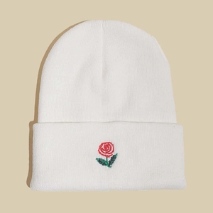 White knit beanie for men and women featuring red rose embroidery on folded cuff