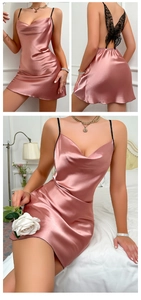Detail of pink satin mini dress featuring black lace butterfly back and thin straps