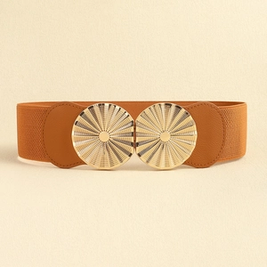 Detail of brown elastic corset belt featuring a textured gold double ring metal buckle
