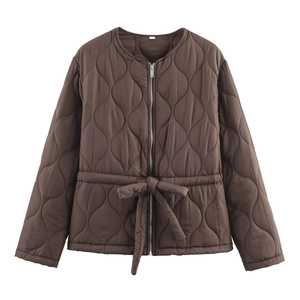 Detailed view of dark brown quilted jacket with drawstring waist and metal zipper
