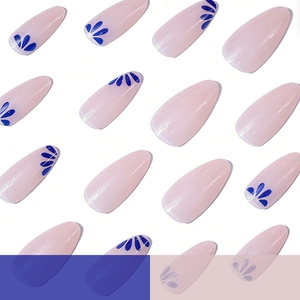 Long almond press-on nails with light pink base and blue floral design 24pcs set