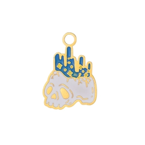Detailed close-up of a skull enamel charm with blue drip and gold stars for DIY jewelry