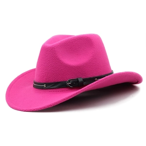 Detail of hot pink wool felt cowboy hat featuring a black leather belt and silver buckle