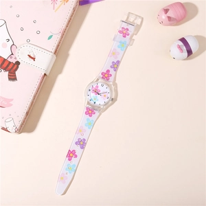 Close-up of kids quartz watch with floral patterns and transparent strap