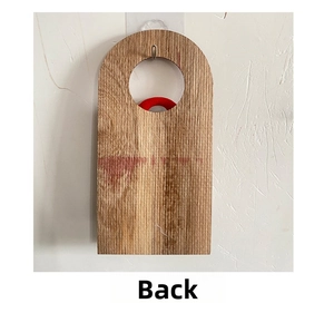 Detail view of the plain wooden texture on the back of the Christmas door hanger