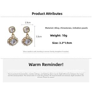 Detail view of vintage pearl and diamond earrings with precise dimensions and materials