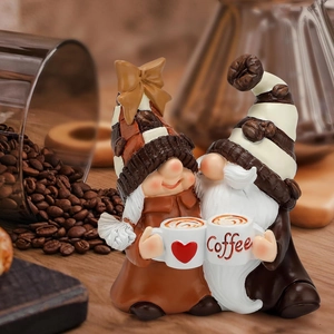 Close-up of resin coffee gnomes with heart patterns and coffee bean hat details