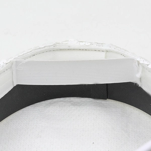 Detailed macro view of the sequin hat interior featuring white elastic strap and inner band