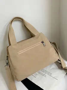 Large capacity beige canvas tote bag with multiple compartments and wide strap
