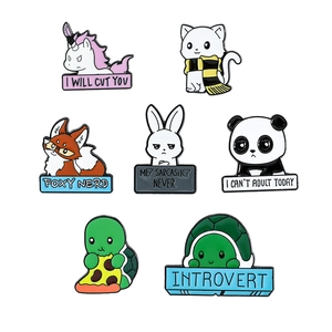Detailed close-up of colorful cartoon animal enamel pins with witty English slogans