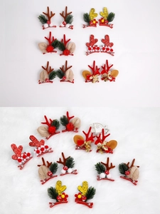 Detail view of festive Christmas antler hair clips with bells and bows for holiday hair styling