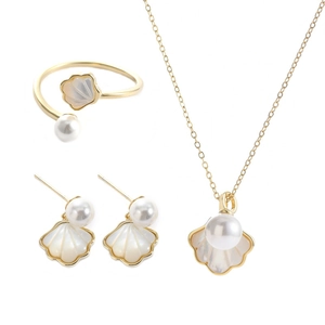 Elegant gold jewelry set with shell pendants, pearl earrings and adjustable open ring