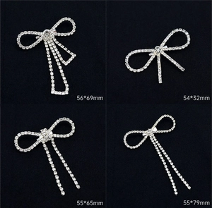 Detailed size specifications for rhinestone butterfly brooches in four elegant designs