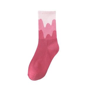 Pink gradient wave pattern crew socks in soft cotton knit style on white background