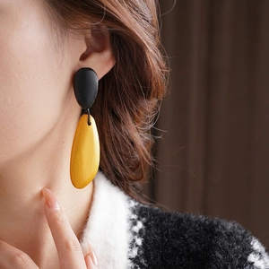 Minimalist irregular wood drop earrings with yellow pebble pendants and black studs