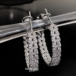 Exquisite sterling silver hoop earrings with shimmering cubic zirconia leaf pattern