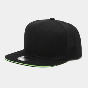 Detail view of black snapback cap featuring neon green brim trim and sport cap sticker