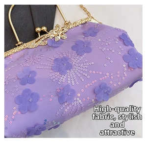 Detailed close-up of purple evening bag featuring 3D flowers, sequins and butterfly clasp