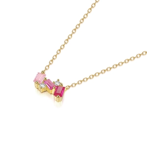 Detail of gold necklace with rectangular pink and red step-cut gemstones and white pavé diamonds