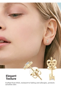 Detail of S925 sterling silver moissanite stud earrings with crown backings and gold plating