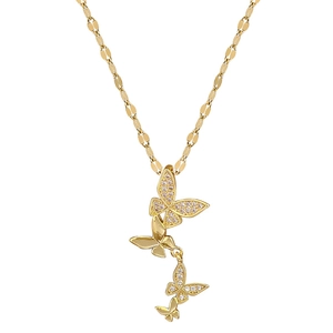 Luxurious butterfly tassel necklace in gold with shimmering crystals and elegant chain