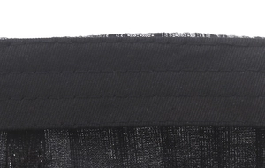 Macro view of black striped cotton linen fabric texture and durable stitched edging