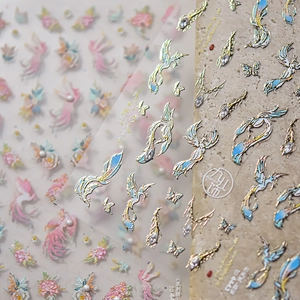 Detailed macro view of 5D embossed nail stickers with gold phoenix and floral patterns