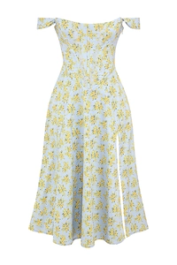 Detailed view of the light blue floral dress with yellow prints and a high side slit